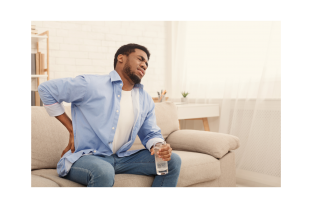 Black man with hand on his lower back